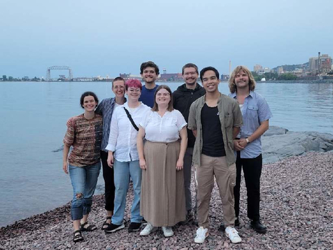 A group of Climate Impact Corps members pose for a photo with Duluth's Canal Park in the background